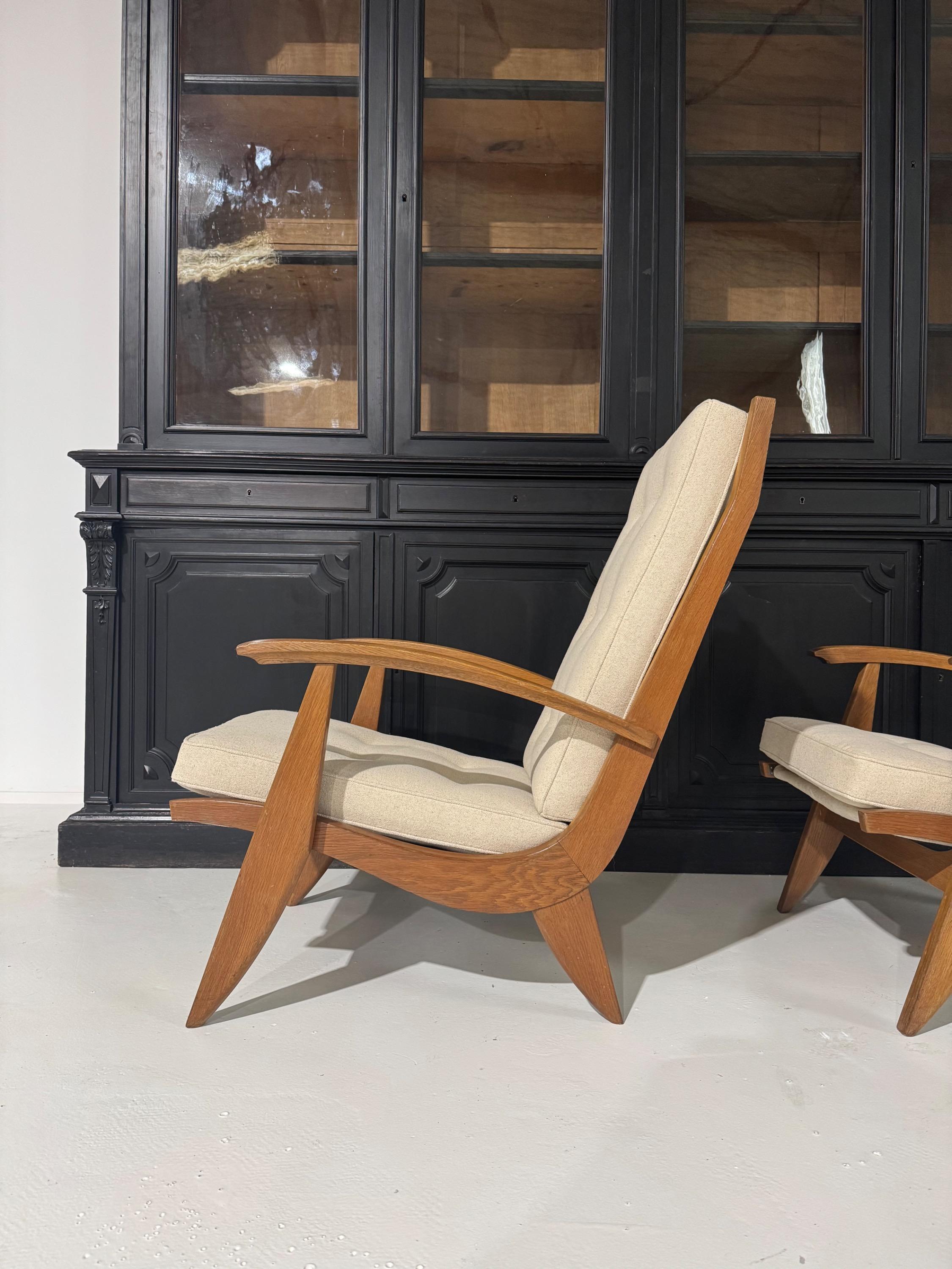 Pair of French Armchairs & Footstool by Guy Besnard FS134 édition Free-Span Circa 1950,covered in Natural Linen.